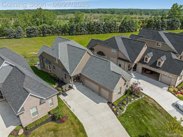 8264 Stoney Creek Dr, South Lyon, MI 48178 - aerial view of property and surrounding area with a heavily wooded area