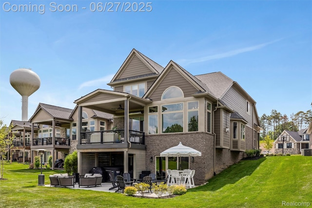 8264 Stoney Creek Dr, South Lyon, MI 48178 - back of property with a yard, brick siding, a patio area, and ceiling fan