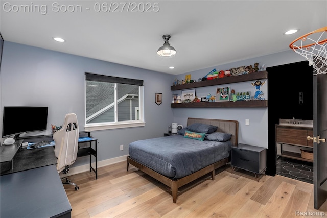 8264 Stoney Creek Dr, South Lyon, MI 48178 - bedroom with light wood-type flooring, a desk, and recessed lighting