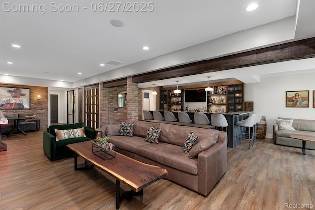 8264 Stoney Creek Dr, South Lyon, MI 48178 - living room featuring wood finished floors, a dry bar, and recessed lighting