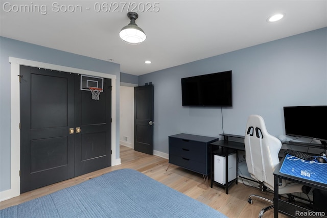 8264 Stoney Creek Dr, South Lyon, MI 48178 - bedroom featuring light wood-style flooring, a desk, and recessed lighting