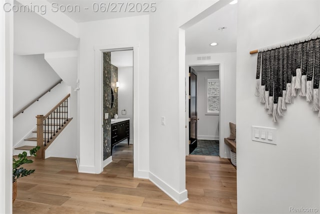 8264 Stoney Creek Dr, South Lyon, MI 48178 - corridor featuring light wood finished floors, recessed lighting, and stairs