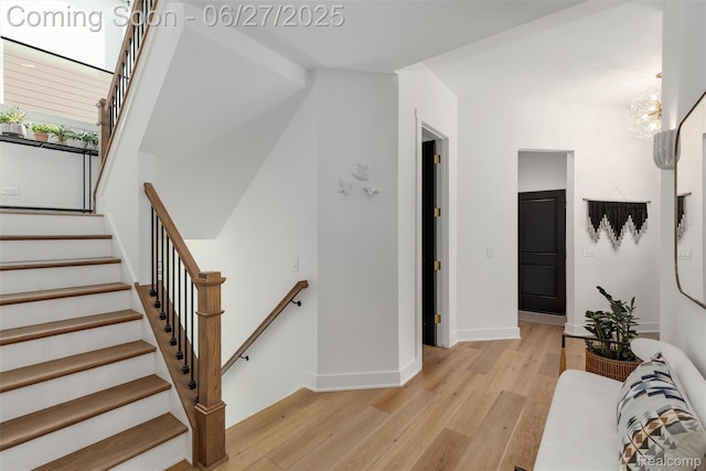 8264 Stoney Creek Dr, South Lyon, MI 48178 - stairway with wood finished floors and baseboards