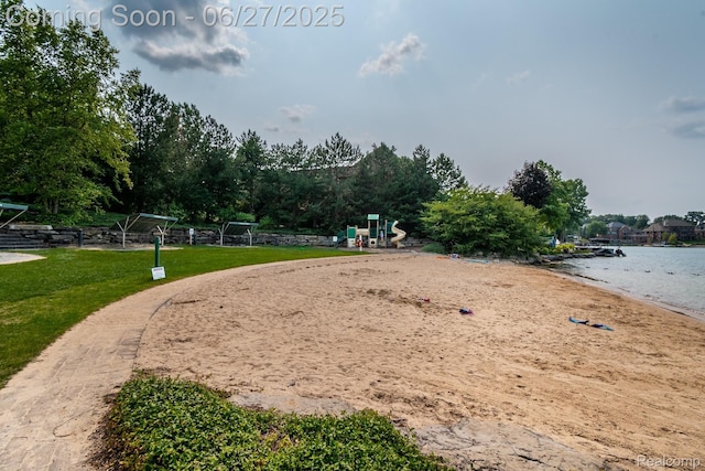 8264 Stoney Creek Dr, South Lyon, MI 48178 - view of property's community with a lawn and view of water and beach