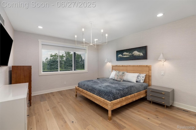 8264 Stoney Creek Dr, South Lyon, MI 48178 - bedroom with a chandelier, light wood-style flooring, and recessed lighting