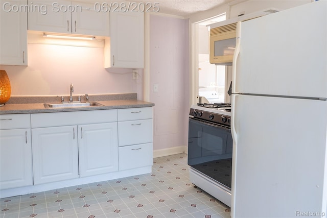 21312 Saint Francis St, Farmington Hills, MI 48336 - kitchen featuring white appliances, white cabinetry, and light countertops