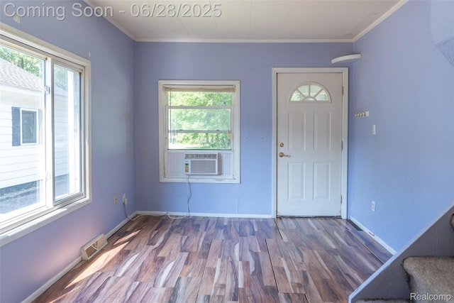 21312 Saint Francis St, Farmington Hills, MI 48336 - foyer entrance featuring plenty of natural light, wood finished floors, cooling unit, and crown molding
