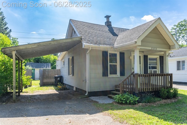 21312 Saint Francis St, Farmington Hills, MI 48336 - view of front of house with a shingled roof and a chimney