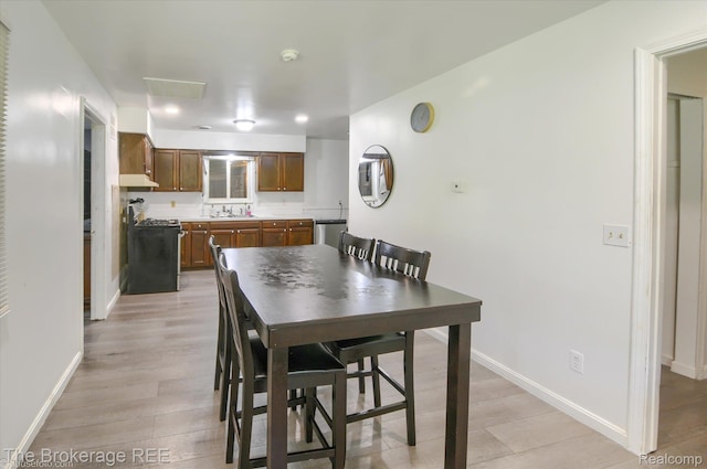 8021 Benson Rd, Mount Morris, MI 48458 - dining area featuring light wood-style floors and recessed lighting