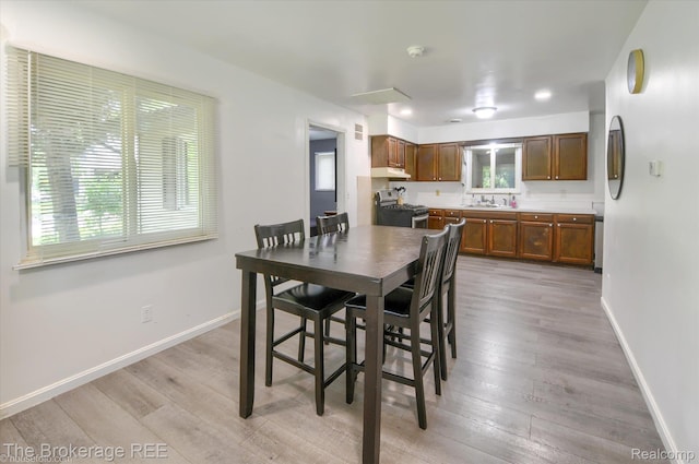 8021 Benson Rd, Mount Morris, MI 48458 - dining area featuring light wood-style flooring and recessed lighting