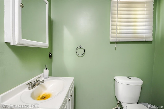 8021 Benson Rd, Mount Morris, MI 48458 - half bathroom featuring vanity and toilet