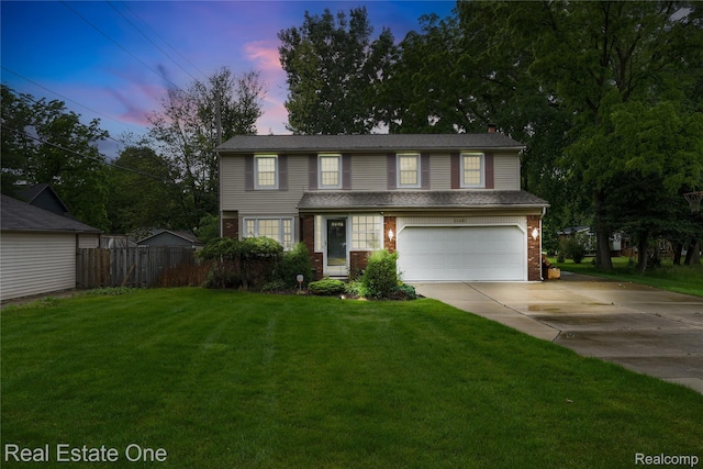 21462 Meridian Rd, Grosse Ile, MI 48138 - traditional-style house featuring concrete driveway, an attached garage, and brick siding