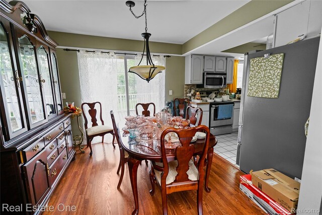21462 Meridian Rd, Grosse Ile, MI 48138 - dining area featuring dark wood-type flooring