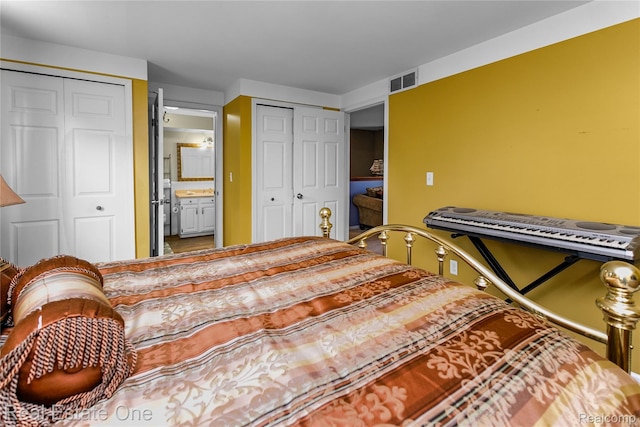 21462 Meridian Rd, Grosse Ile, MI 48138 - bedroom featuring two closets