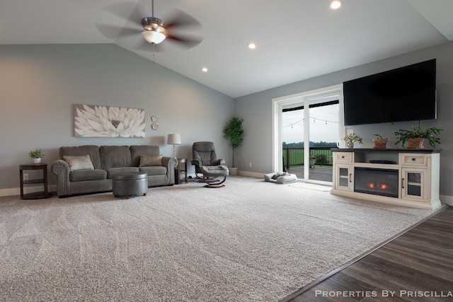 21491 8th Ave, Conklin, MI 49403 - living room with a ceiling fan, lofted ceiling, a glass covered fireplace, recessed lighting, and wood finished floors