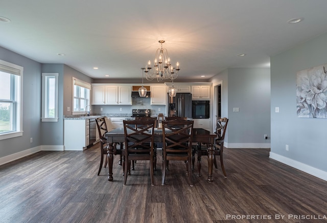 21491 8th Ave, Conklin, MI 49403 - dining space featuring dark wood-style floors, a chandelier, and recessed lighting