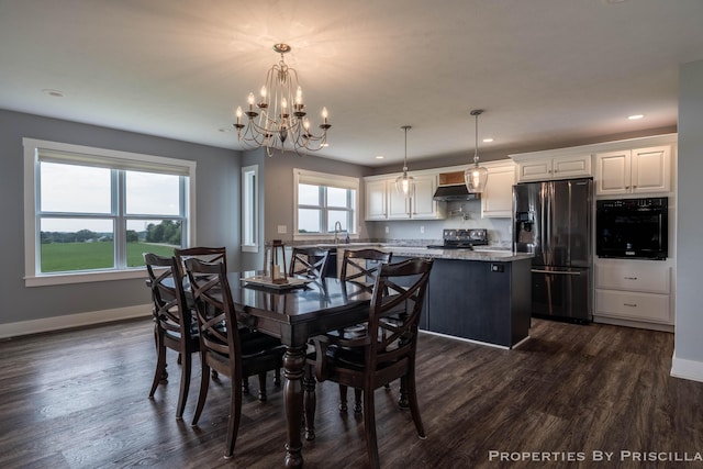 21491 8th Ave, Conklin, MI 49403 - dining space featuring a chandelier, recessed lighting, and dark wood-type flooring