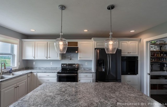 21491 8th Ave, Conklin, MI 49403 - kitchen featuring black appliances, white cabinets, hanging light fixtures, recessed lighting, and dark stone counters