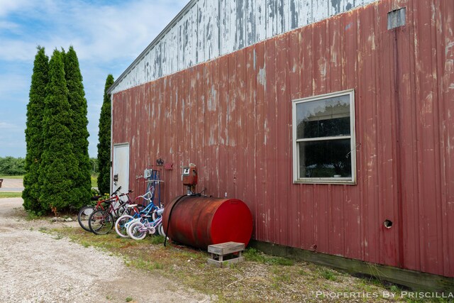21491 8th Ave, Conklin, MI 49403 - view of home's exterior with oil tank