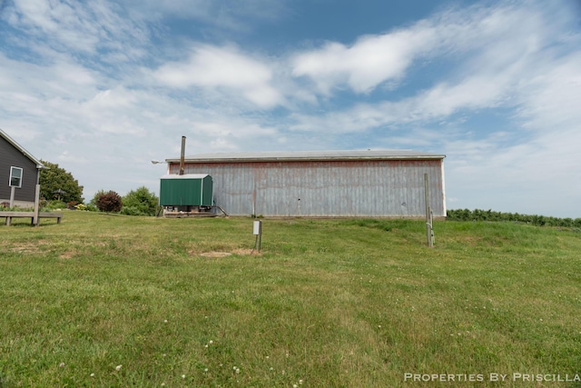 21491 8th Ave, Conklin, MI 49403 - view of green lawn featuring a pole building and an outdoor structure