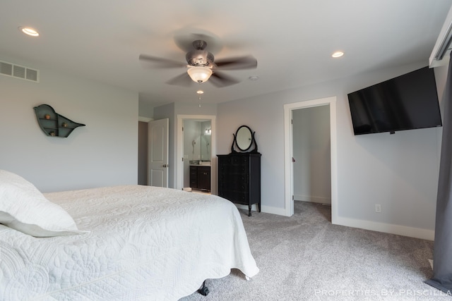 21491 8th Ave, Conklin, MI 49403 - bedroom with light colored carpet, recessed lighting, ceiling fan, and connected bathroom
