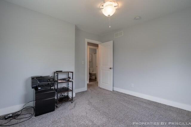 21491 8th Ave, Conklin, MI 49403 - carpeted bedroom with baseboards and a desk