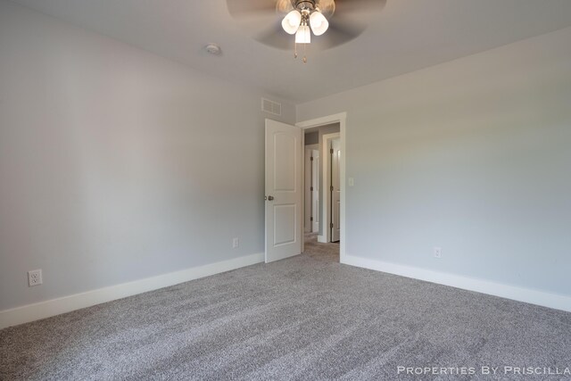 21491 8th Ave, Conklin, MI 49403 - spare room featuring carpet floors, ceiling fan, and a smoke detector