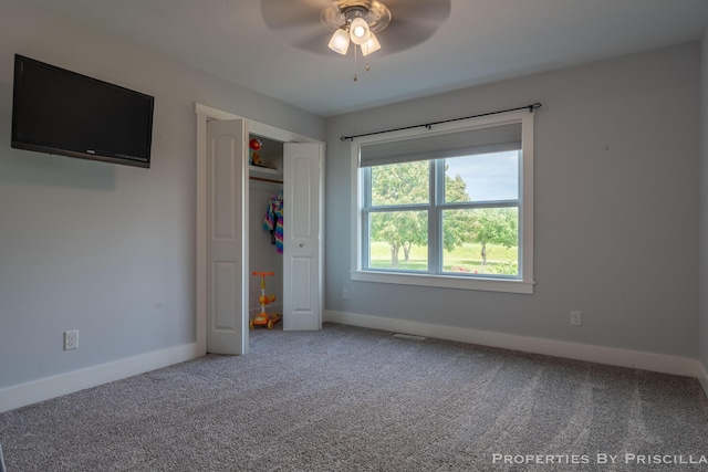 21491 8th Ave, Conklin, MI 49403 - unfurnished bedroom featuring carpet, a closet, and ceiling fan
