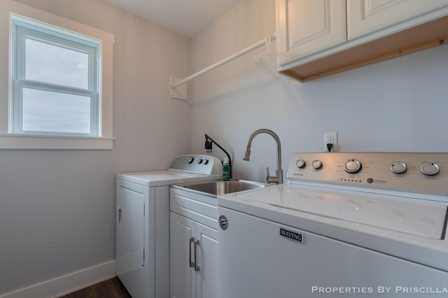 21491 8th Ave, Conklin, MI 49403 - washroom with washing machine and dryer, cabinet space, and dark wood-style floors