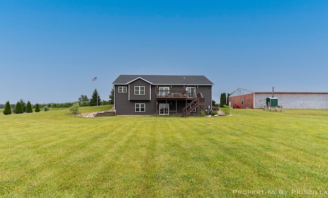 21491 8th Ave, Conklin, MI 49403 - back of property featuring a wooden deck, a lawn, and stairs