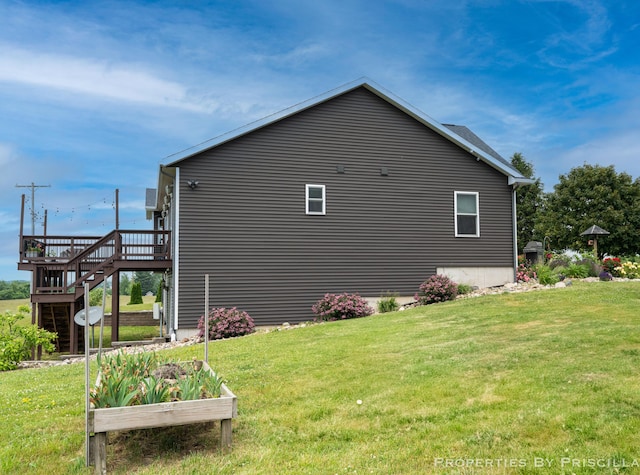 21491 8th Ave, Conklin, MI 49403 - view of side of home featuring stairway, a deck, and a yard