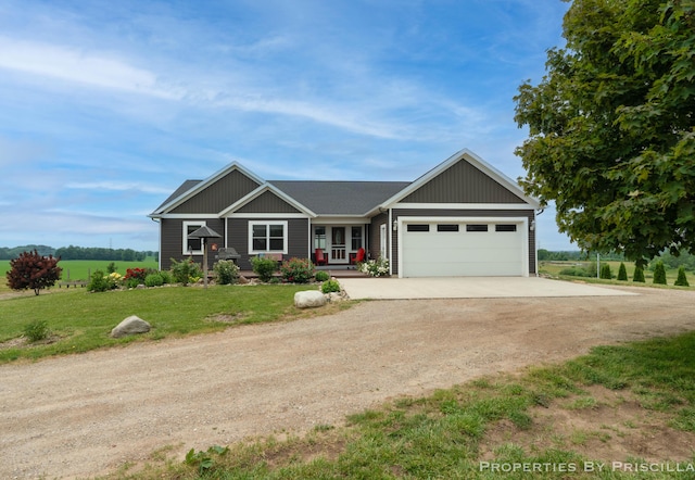 21491 8th Ave, Conklin, MI 49403 - view of front of home featuring dirt driveway, an attached garage, and a front lawn