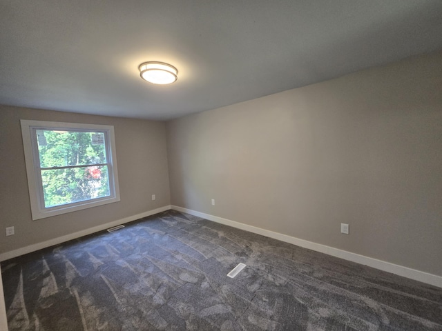 2159 E Eden Ct, Ann Arbor, MI 48108 - unfurnished room with baseboards and dark colored carpet