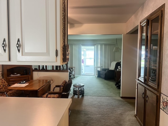 5804 Leisure S Dr SE, Grand Rapids, MI 49548 - kitchen with dark colored carpet and white cabinetry