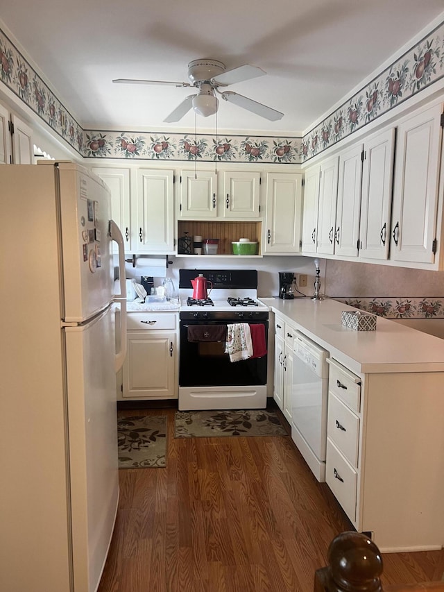5804 Leisure S Dr SE, Grand Rapids, MI 49548 - kitchen with white appliances, light countertops, a ceiling fan, dark wood finished floors, and white cabinets