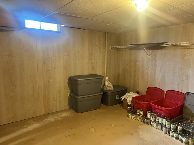 5804 Leisure S Dr SE, Grand Rapids, MI 49548 - basement with wood walls and a drop ceiling