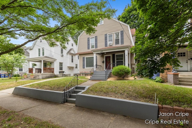 109 Fuller Ave SE, Grand Rapids, MI 49506 - colonial inspired home featuring a porch and a gambrel roof