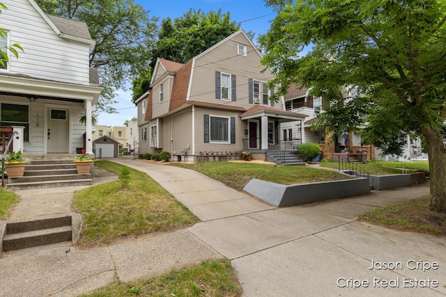 109 Fuller Ave SE, Grand Rapids, MI 49506 - view of front of home with an outbuilding, driveway, and a detached garage