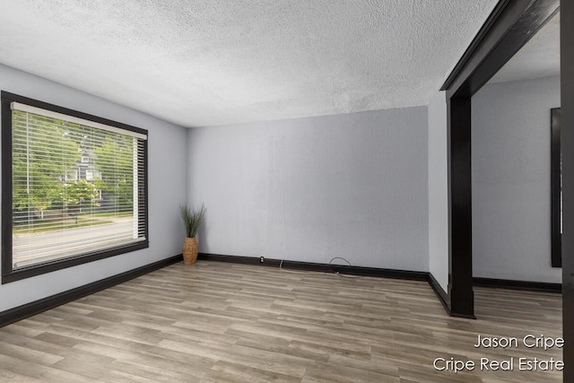 109 Fuller Ave SE, Grand Rapids, MI 49506 - unfurnished room featuring wood finished floors and a textured ceiling