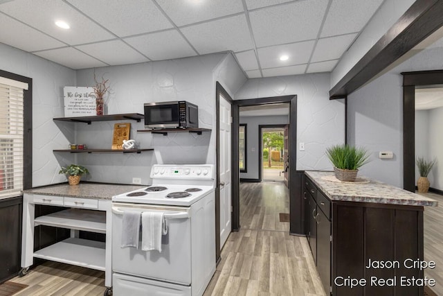 109 Fuller Ave SE, Grand Rapids, MI 49506 - kitchen featuring white electric range, stainless steel microwave, light wood-style floors, a drop ceiling, and open shelves