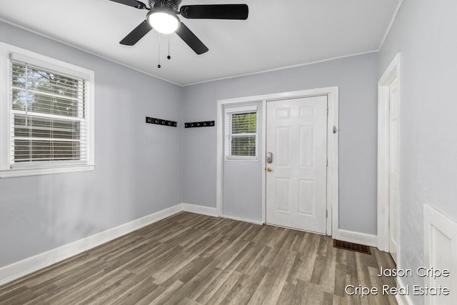 109 Fuller Ave SE, Grand Rapids, MI 49506 - foyer entrance featuring wood finished floors, crown molding, and ceiling fan
