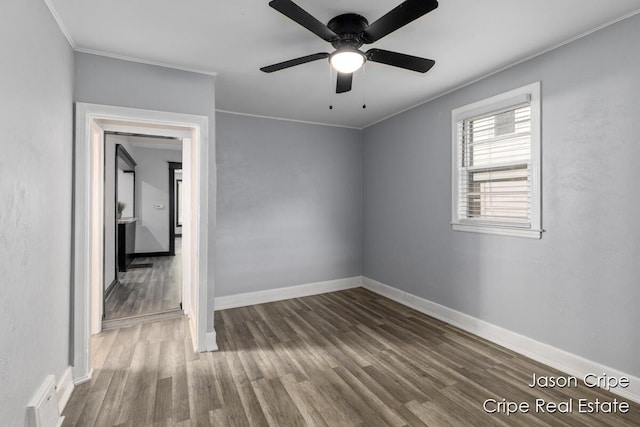 109 Fuller Ave SE, Grand Rapids, MI 49506 - empty room featuring wood finished floors, ornamental molding, ceiling fan, and a baseboard heating unit