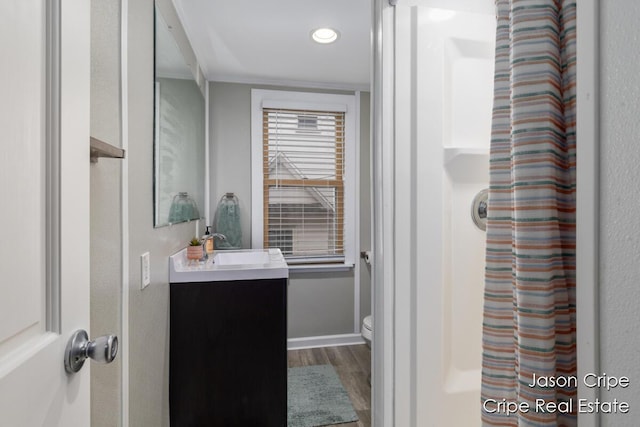 109 Fuller Ave SE, Grand Rapids, MI 49506 - full bathroom with wood finished floors, vanity, recessed lighting, and a shower with shower curtain