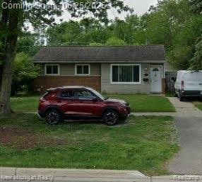 21845 Inkster Rd, Farmington Hills, MI 48336 - view of front of house featuring a front lawn and driveway