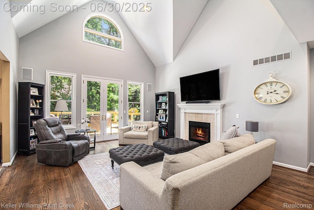 2868 Masters Ct, Pinckney, MI 48169 - living room featuring a fireplace, high vaulted ceiling, and dark wood-style floors