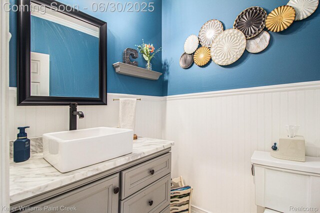 2868 Masters Ct, Pinckney, MI 48169 - half bathroom featuring a wainscoted wall and vanity