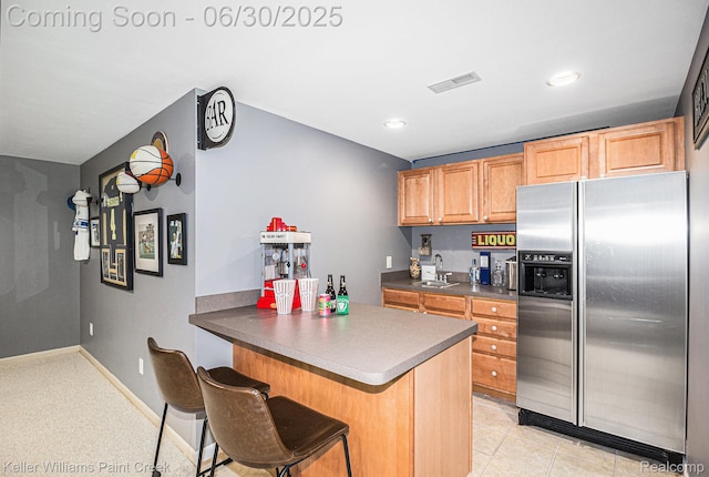 2868 Masters Ct, Pinckney, MI 48169 - kitchen with stainless steel refrigerator with ice dispenser, dark countertops, a peninsula, a breakfast bar, and recessed lighting