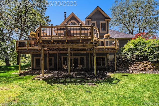 2868 Masters Ct, Pinckney, MI 48169 - back of house with a lawn, a wooden deck, and a patio
