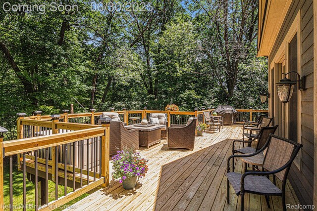 2868 Masters Ct, Pinckney, MI 48169 - wooden deck with an outdoor hangout area, view of scattered trees, and a grill