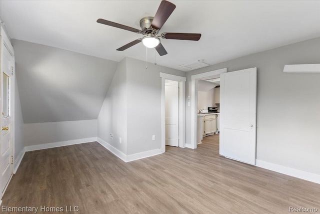 45866 Gable Inn St, Shelby Twp, MI 48317 - bonus room with light wood-style floors, a ceiling fan, and attic access